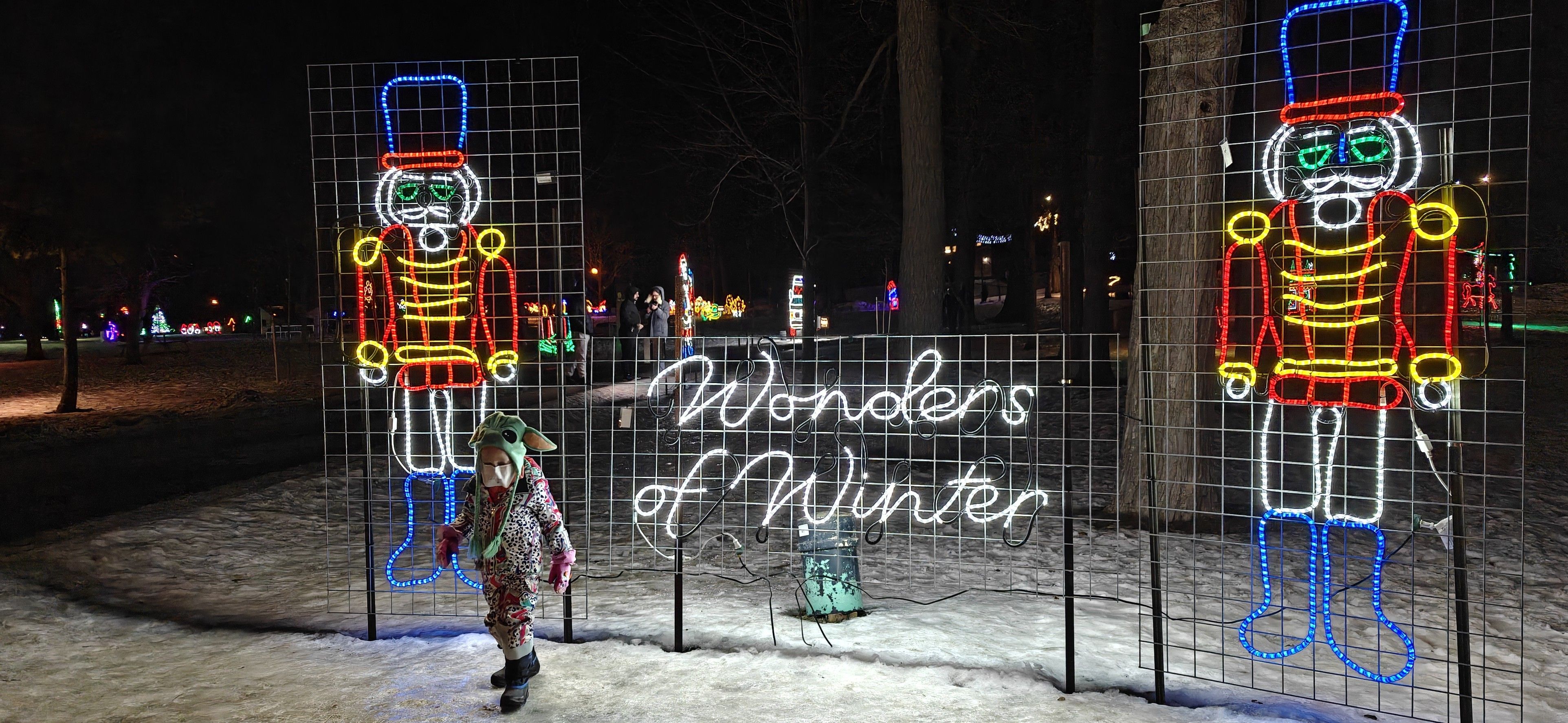 A great little guy in a new-for-Christmas Grogu hat in front of the Waterloo Park's Wonders of Winter sign.